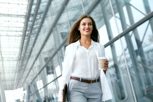 Beautiful Woman Going To Work With Coffee